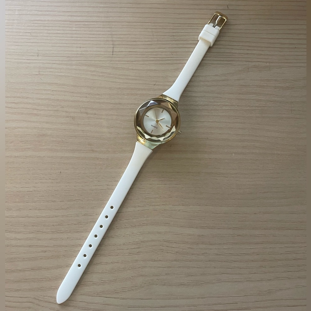white and gold small watch